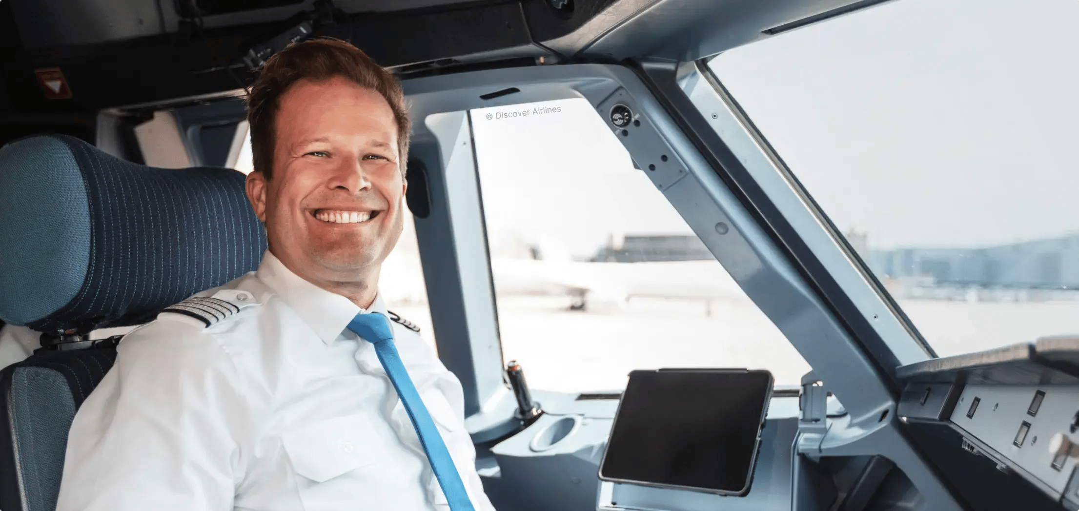 Happy pilot inside cockpit
