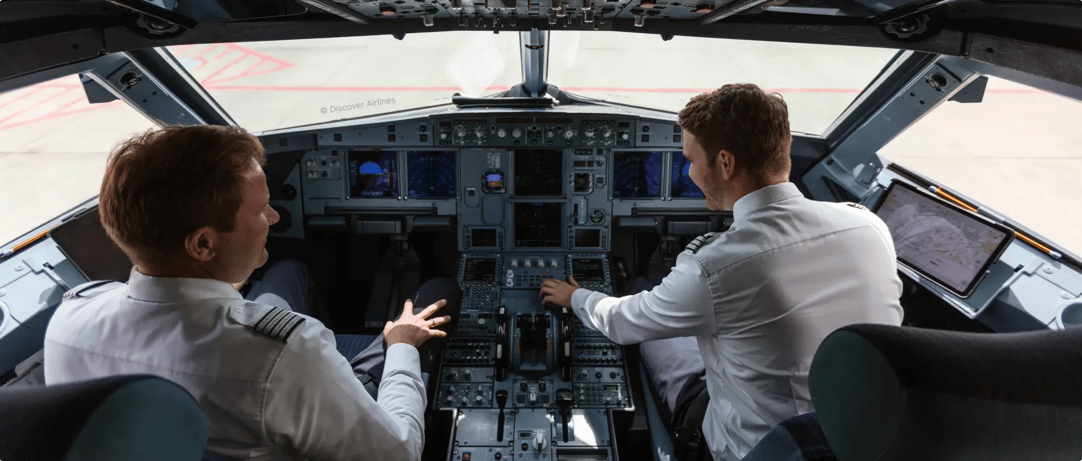 Two pilots inside cockpit