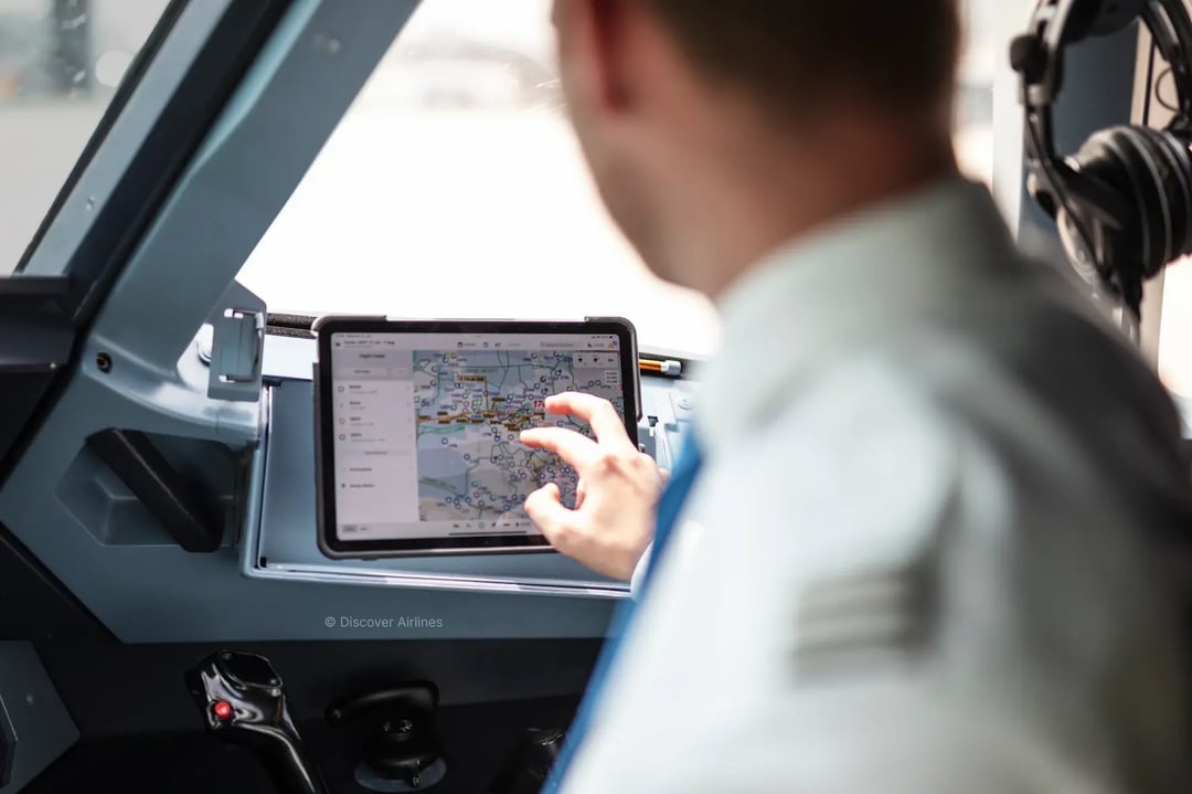 Pilot using tablet inside cockpit 