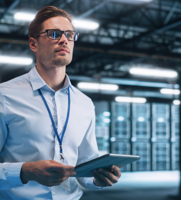 Man working in data center with tablet